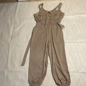 Jump suit . Tan. Beautiful tan jump suit.,